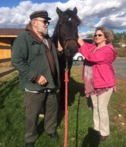 Two people with Bodie the horse at Ephphatha Farms