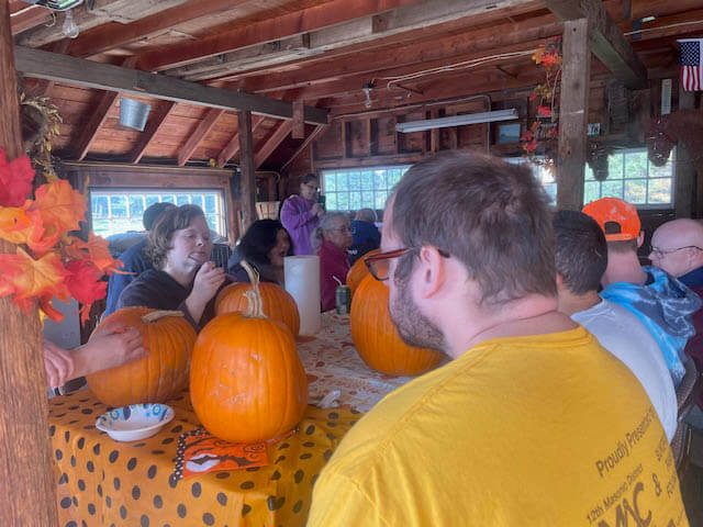 Farm friends preparing to paint pumpkins